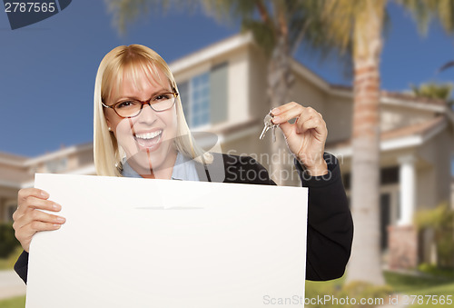 Image of Excited Woman Holding House Keys and Blank Real Estate Sign