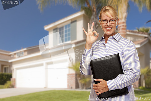 Image of Attractive Businesswoman In Front of Nice Residential Home