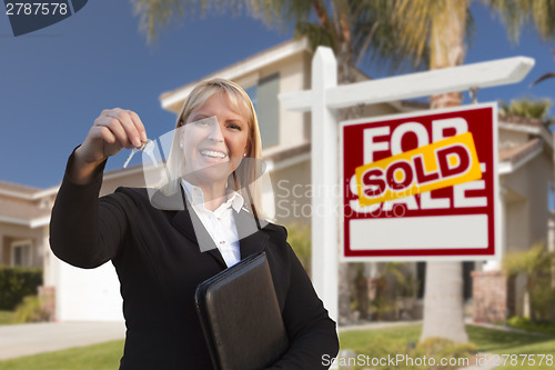 Image of Female Real Estate Agent Handing Over the House Keys