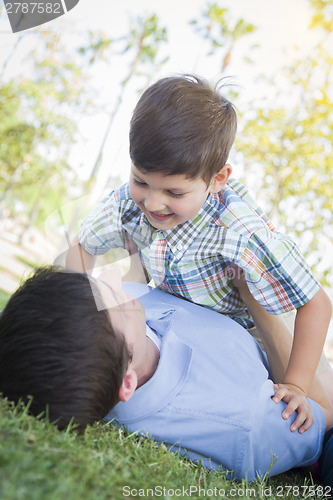 Image of Father and Son Playing Together in the Park