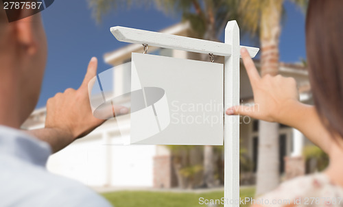 Image of Blank Real Estate Sign, House and Military Couple Framing Hands