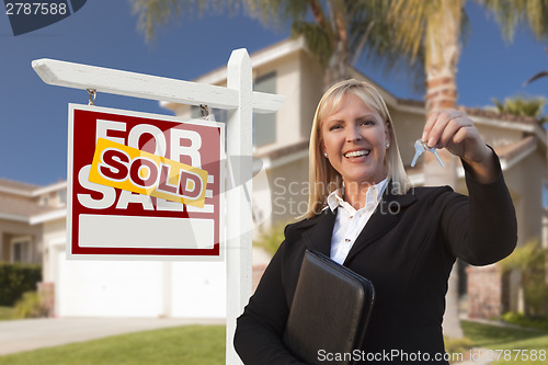 Image of Female Real Estate Agent Handing Over the House Keys