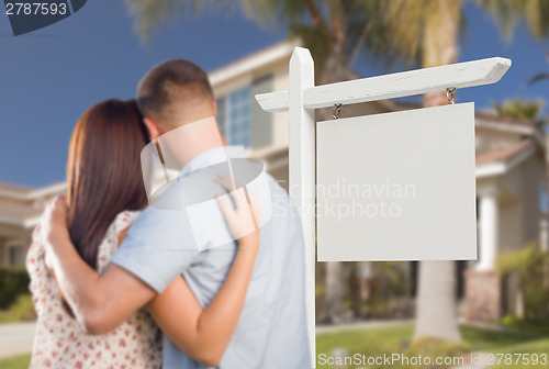 Image of Blank Real Estate Sign and Military Couple Looking at House