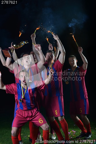 Image of soccer players celebrating victory