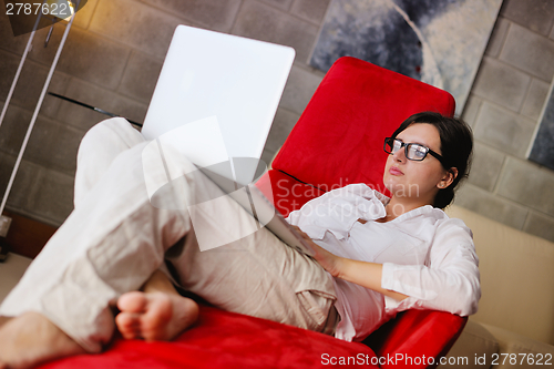 Image of woman using a laptop computer at home