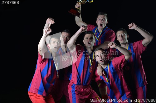 Image of soccer players celebrating victory