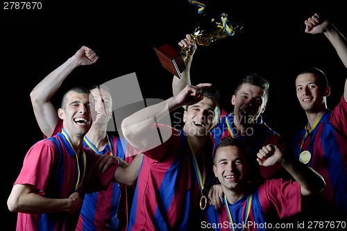 Image of soccer players celebrating victory