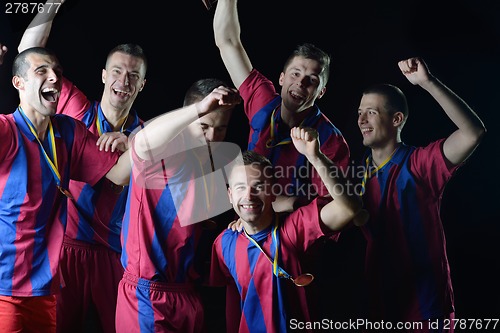 Image of soccer players celebrating victory