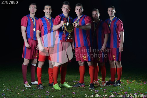 Image of soccer players celebrating victory