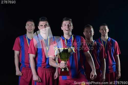 Image of soccer players celebrating victory