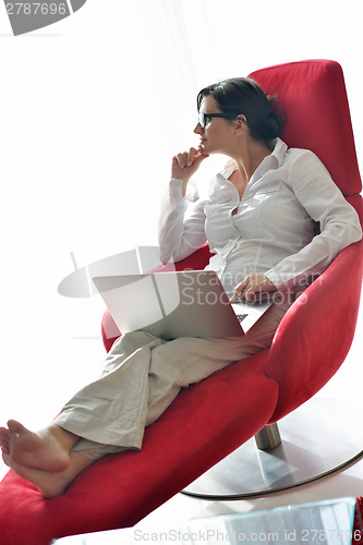 Image of woman using a laptop computer at home