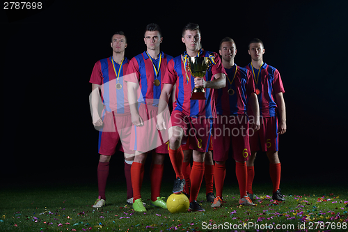 Image of soccer players celebrating victory