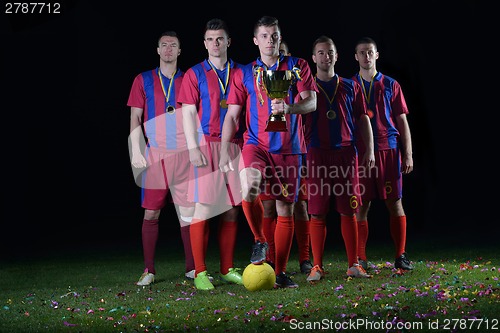 Image of soccer players celebrating victory