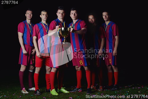 Image of soccer players celebrating victory