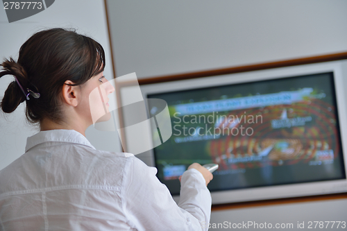 Image of happy young woman relax at home on sofa