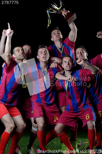 Image of soccer players celebrating victory