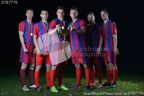 Image of soccer players celebrating victory