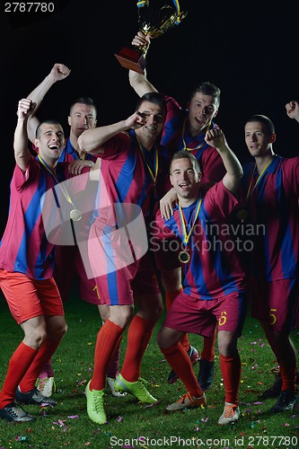 Image of soccer players celebrating victory