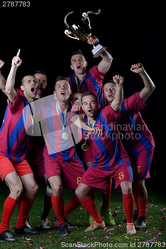 Image of soccer players celebrating victory