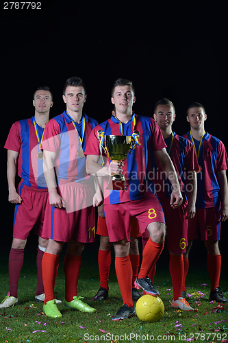 Image of soccer players celebrating victory