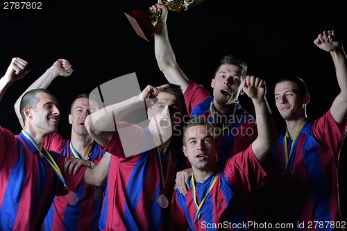 Image of soccer players celebrating victory