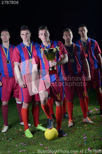 Image of soccer players celebrating victory