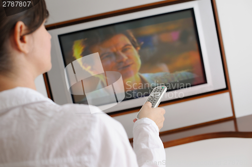 Image of happy young woman relax at home on sofa