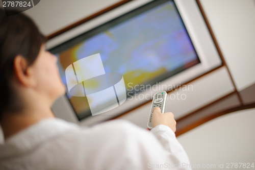 Image of happy young woman relax at home on sofa