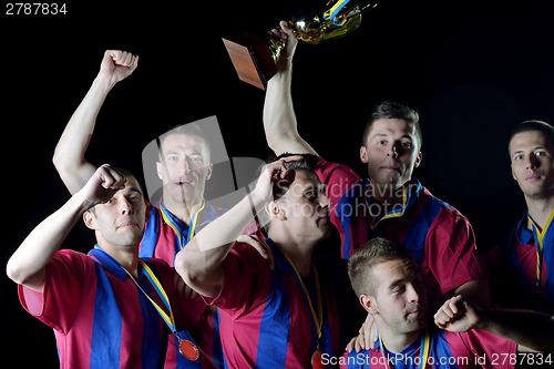 Image of soccer players celebrating victory