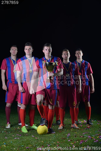 Image of soccer players celebrating victory