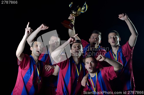 Image of soccer players celebrating victory