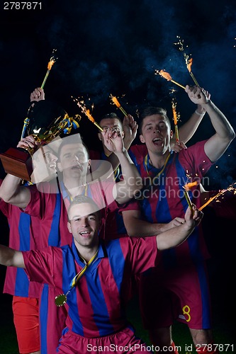 Image of soccer players celebrating victory
