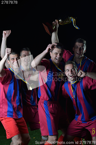 Image of soccer players celebrating victory