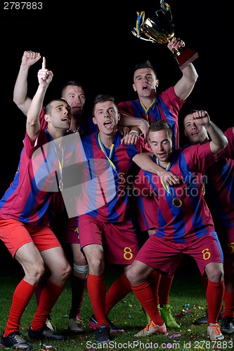 Image of soccer players celebrating victory