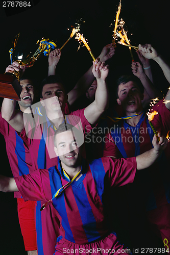 Image of soccer players celebrating victory