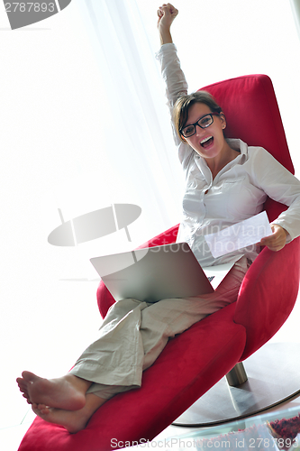 Image of woman using a laptop computer at home
