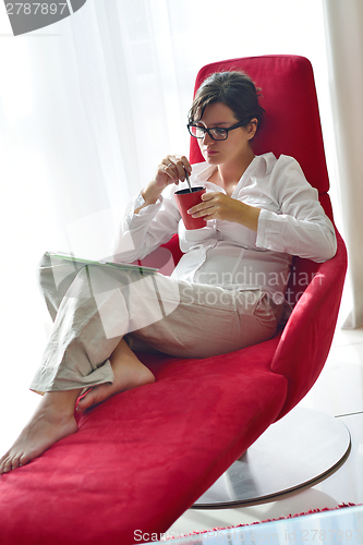 Image of woman using tablet pc at home