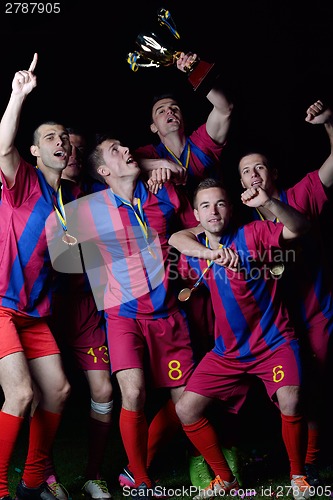 Image of soccer players celebrating victory