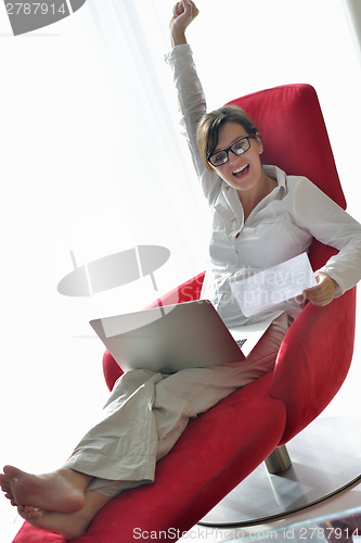 Image of woman using a laptop computer at home