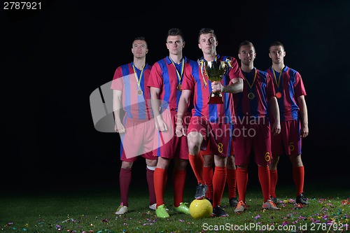 Image of soccer players celebrating victory