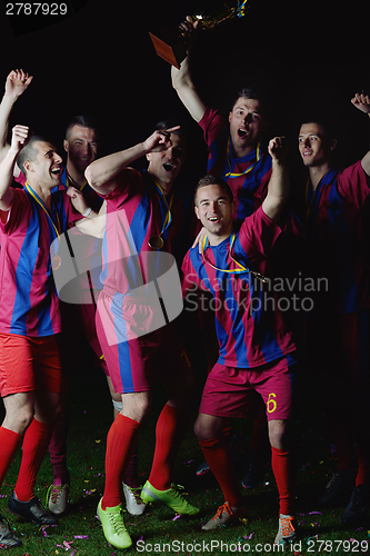 Image of soccer players celebrating victory