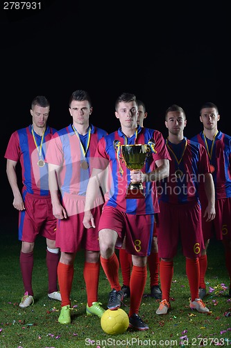 Image of soccer players celebrating victory