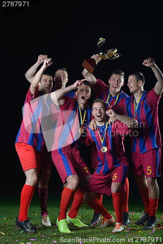 Image of soccer players celebrating victory