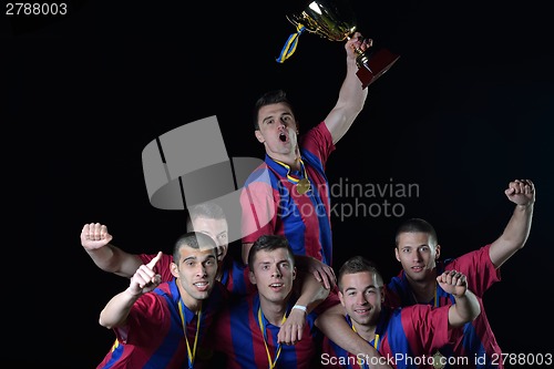 Image of soccer players celebrating victory