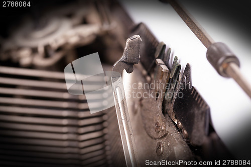 Image of Close-up of an old retro typewriter with paper