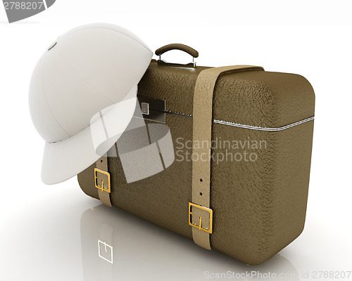 Image of Brown traveler's suitcase and peaked cap 