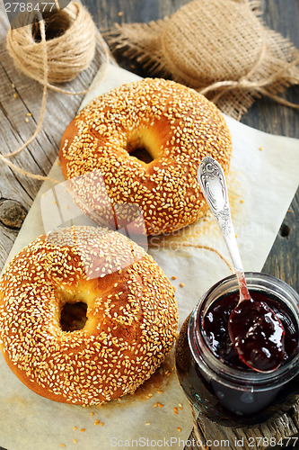 Image of Bagels and jam in a jar.