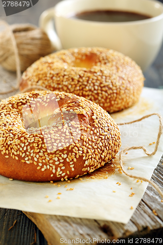 Image of Breakfast. Sweet bagels with sesame seeds and coffee.