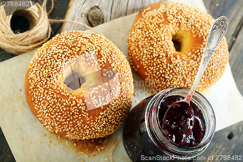Image of Homemade bagels and lingonberry jam closeup. 
