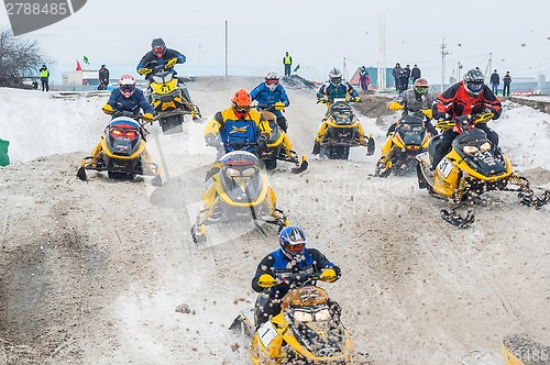 Image of Racing of sportsmen on snowmobile